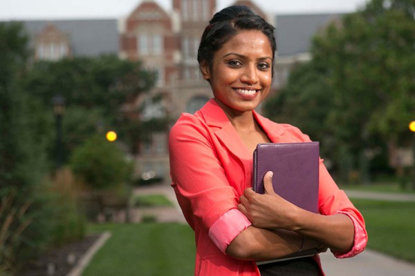 Woman in her MBA program in from of Davis Building at Friends University
